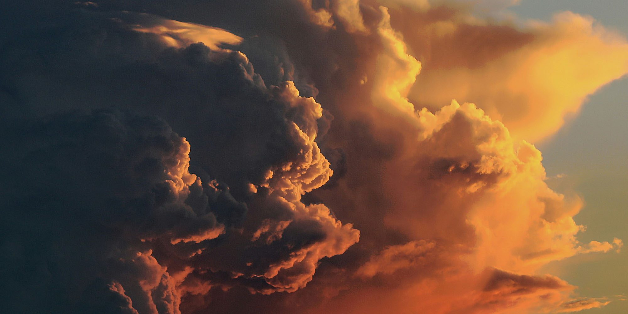 Apple faces yet another EU antitrust investigation, this time for preferencing iCloud | Photo shows stormy-looking clouds at sunset