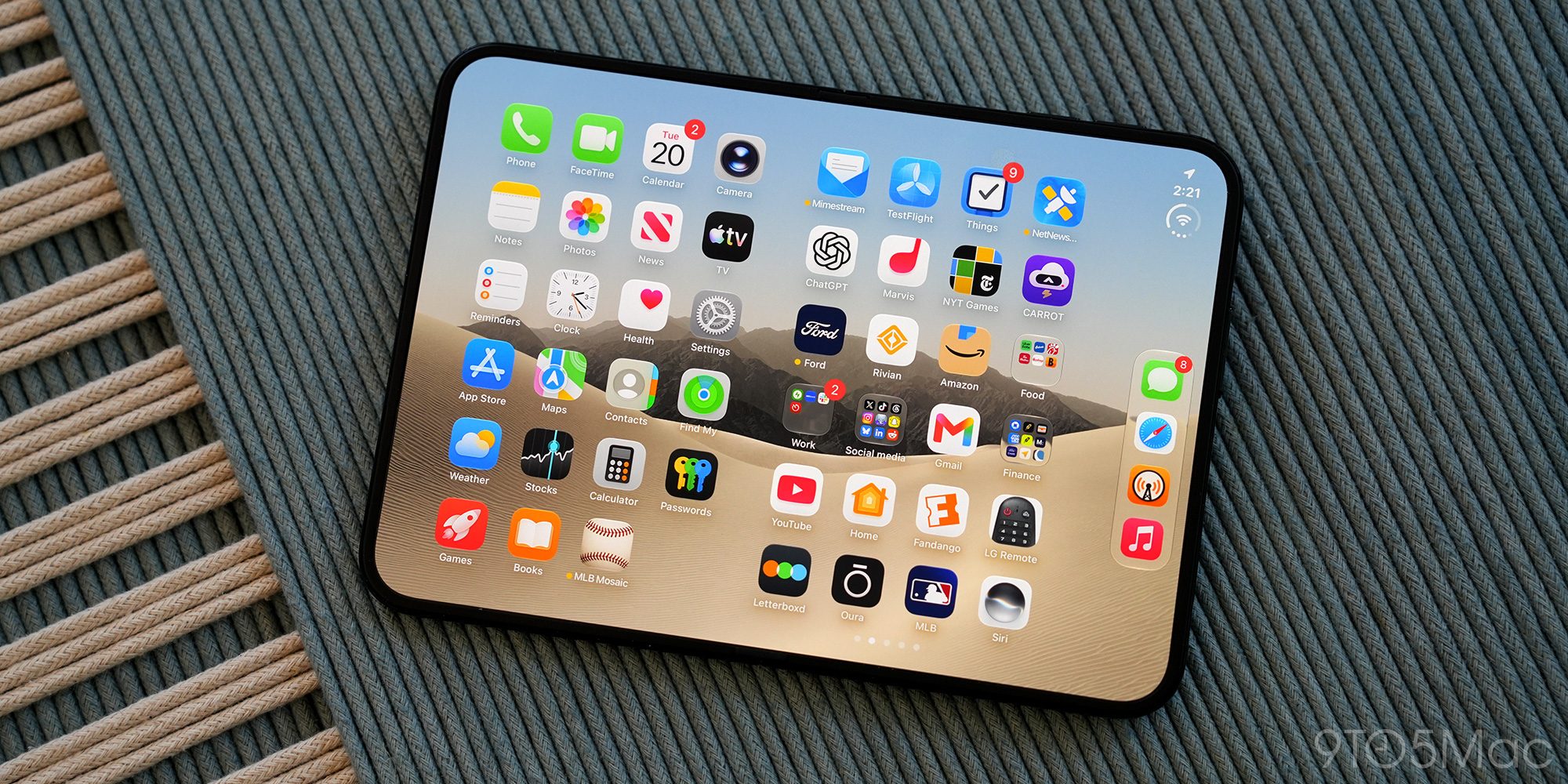 Apple reportedly boosts iPhone Duo orders by more than 40% given strong demand | Photo shows an open iPhone Duo on a mat